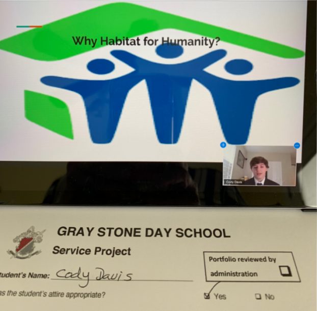 Gray Stone senior Cody Davis presents his senior project, where he volunteered with Habitat for Humanity, to a group of teachers and community members. Photo courtesy of Helen Nance.