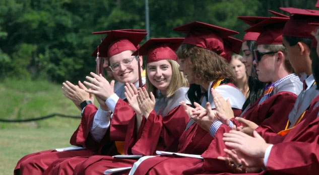 Members of the Class of 2024 at Gray Stone applaud for this year's scholarship winner, June Barney (middle). (Photo by Charles Curcio/staff)