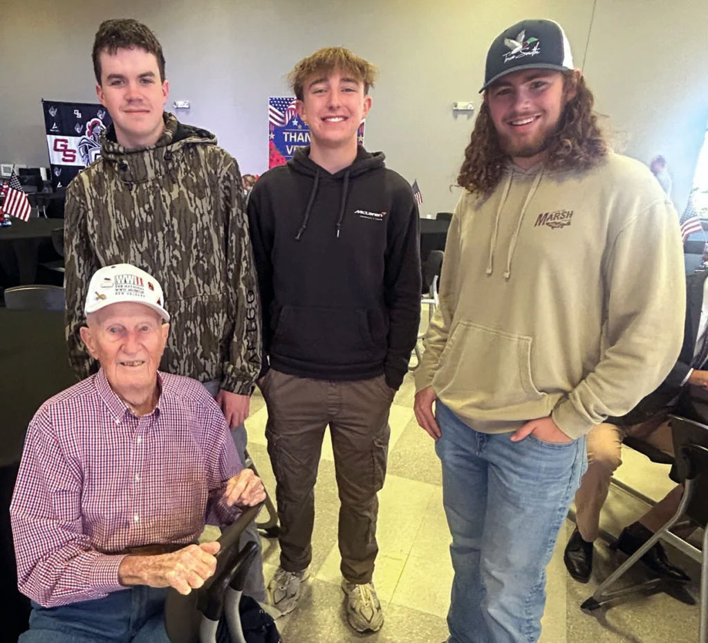 World War II veteran James “Jim” Deal is joined by Gray Stone seniors Wesley Plyler, Evan Barber and Xavier Browning at a breakfast honoring veterans Nov. 13 at the school.