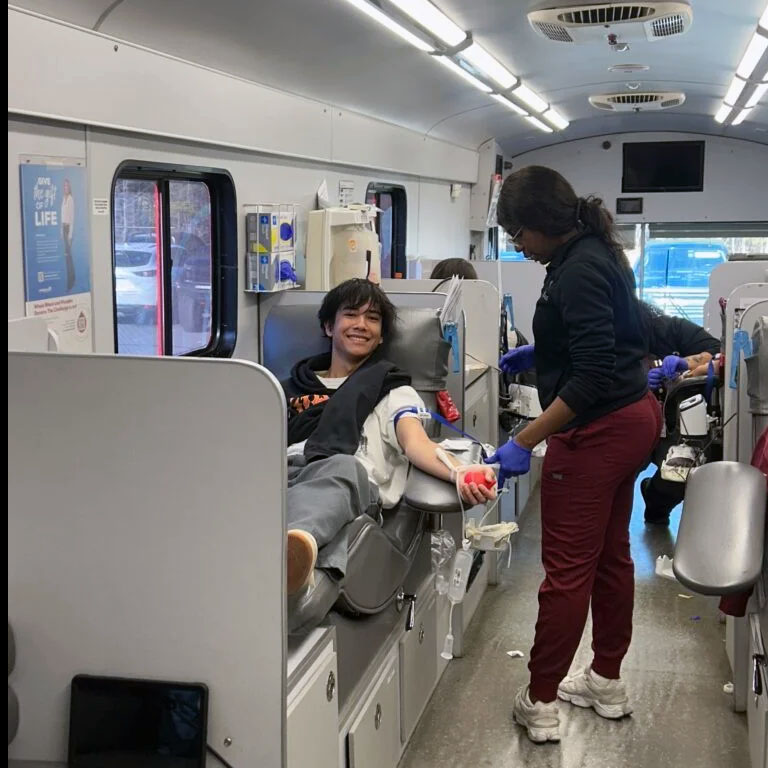 Kaden Mabry donates blood at his blood drive at Gray Stone Day School. The OneBlood drive was part of Mabry’s senior community service project.